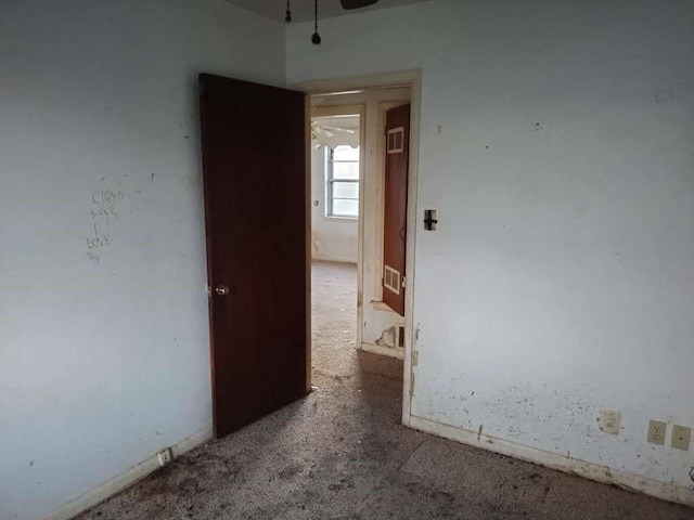 unfurnished room featuring carpet flooring