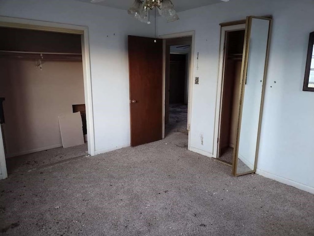 unfurnished bedroom with carpet flooring and baseboards