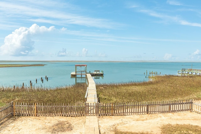 exterior space with fence and a dock