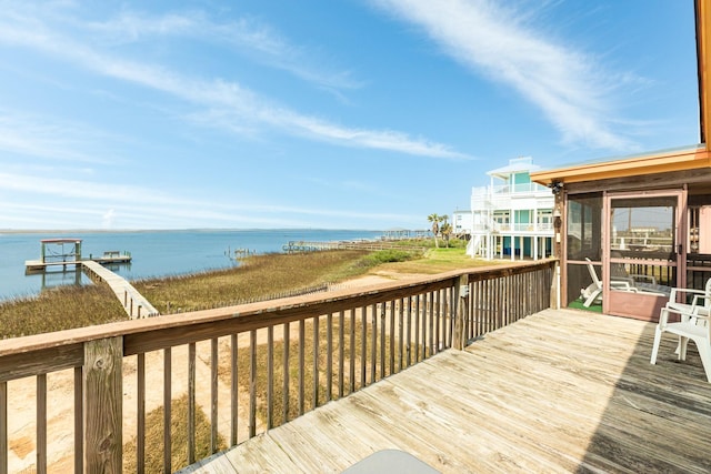 wooden deck featuring a water view