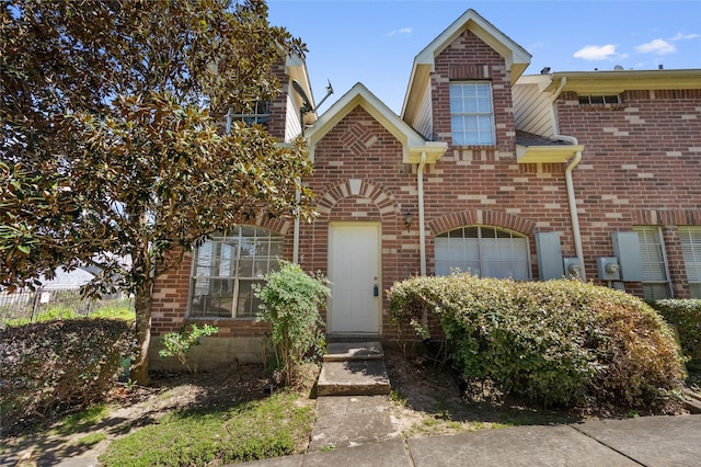 view of front of house with brick siding