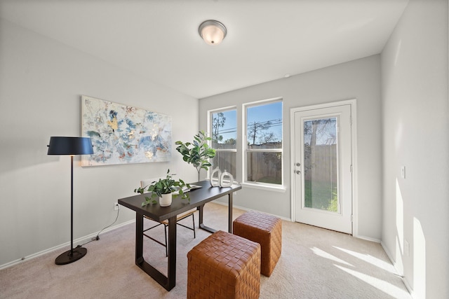 carpeted office featuring baseboards