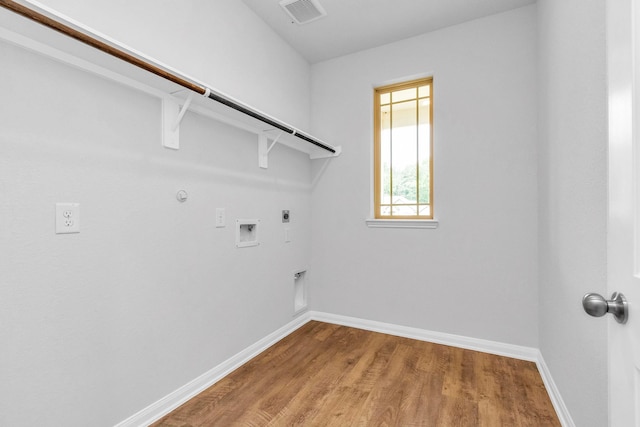 laundry room with electric dryer hookup, washer hookup, baseboards, gas dryer hookup, and laundry area