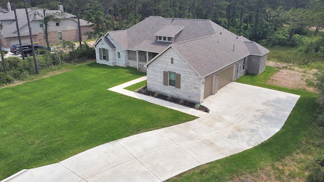 birds eye view of property with a forest view