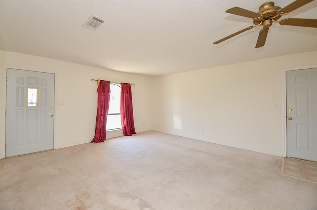 carpeted empty room with visible vents