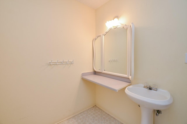 bathroom featuring tile patterned floors and baseboards