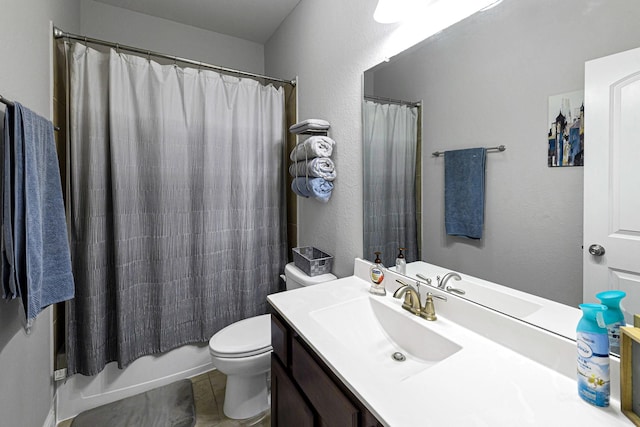 bathroom featuring tile patterned floors, toilet, vanity, and shower / tub combo