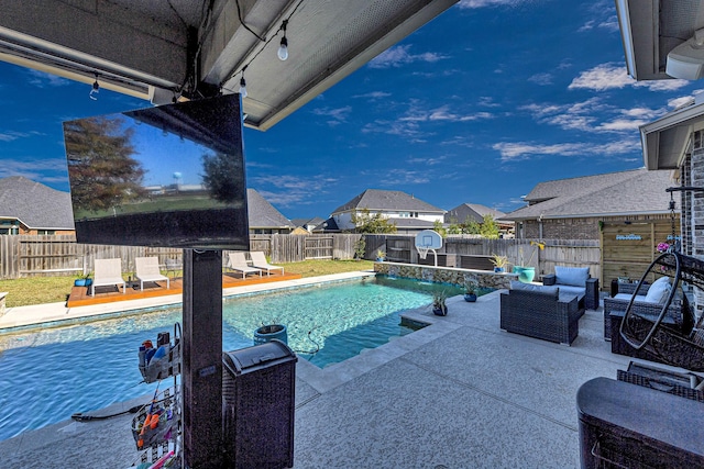 view of pool featuring a patio, a fenced backyard, a fenced in pool, and an outdoor hangout area