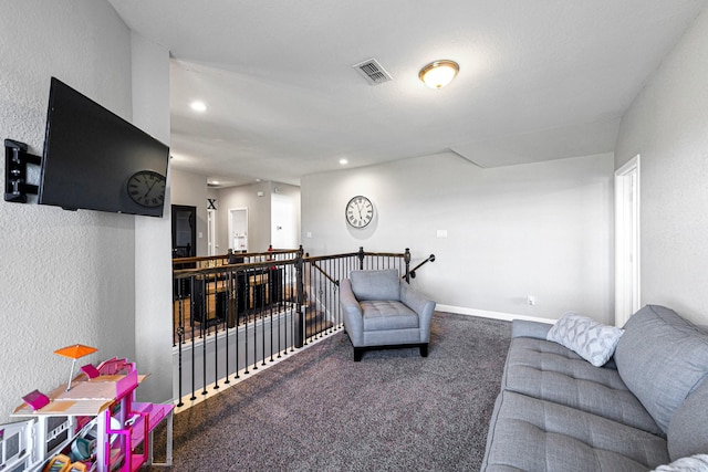 living area with recessed lighting, baseboards, visible vents, and carpet floors