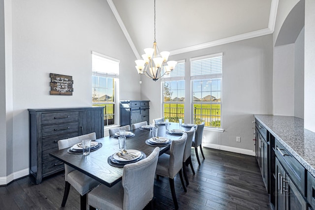 dining space with baseboards, high vaulted ceiling, dark wood-style flooring, crown molding, and a notable chandelier