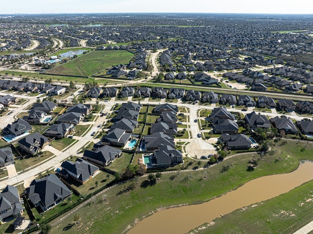 aerial view featuring a residential view and a water view