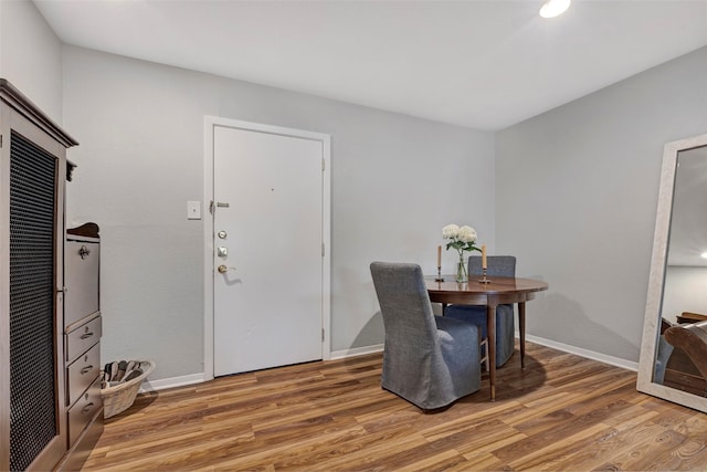 office area featuring light wood-style flooring and baseboards