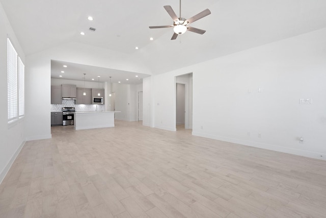 unfurnished living room featuring high vaulted ceiling, recessed lighting, light wood finished floors, baseboards, and ceiling fan