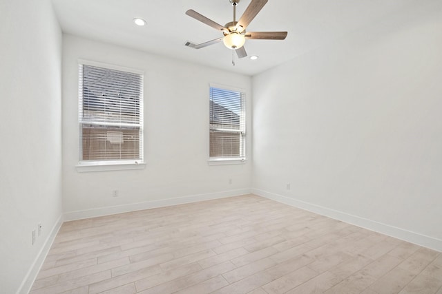 unfurnished room featuring recessed lighting, light wood-style flooring, baseboards, and ceiling fan