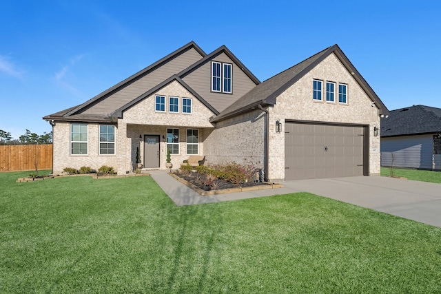 view of front of house featuring a front lawn, driveway, fence, a garage, and brick siding