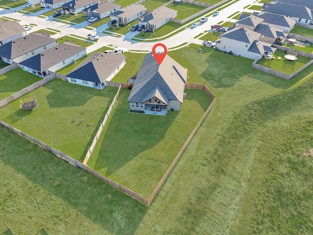 birds eye view of property with a residential view