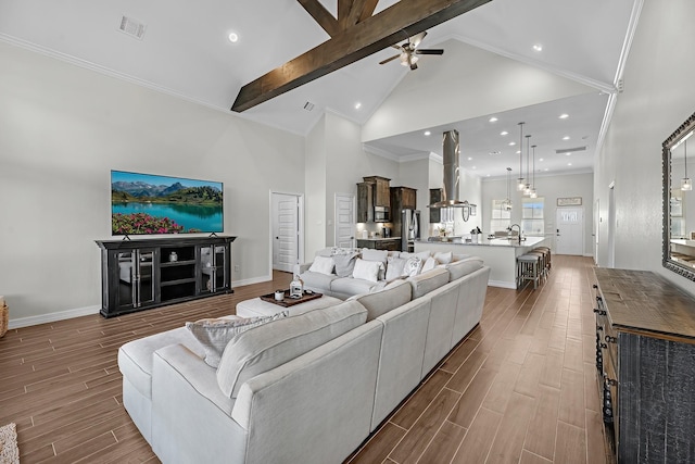 living area with beam ceiling, high vaulted ceiling, visible vents, and wood tiled floor