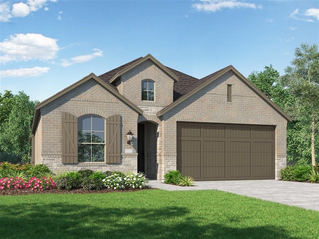 french provincial home featuring a front yard, driveway, stone siding, a garage, and brick siding