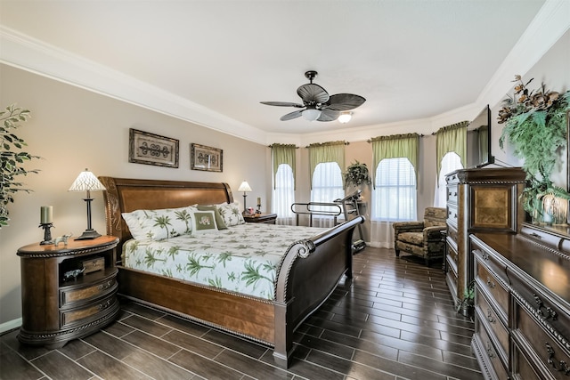 bedroom with crown molding, a ceiling fan, baseboards, and wood finish floors