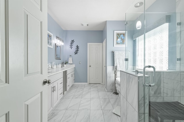 bathroom with visible vents, marble finish floor, a stall shower, and vanity