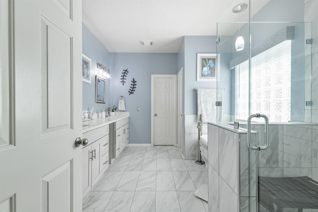 31331 Polaris Blvd, Tomball, TX 77375 - bathroom with vanity, marble look tiles, and a shower stall
