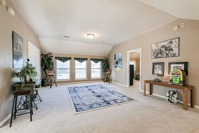 living area with visible vents, carpet flooring, baseboards, and lofted ceiling