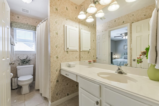 ensuite bathroom with tile patterned flooring, visible vents, wallpapered walls, toilet, and vanity