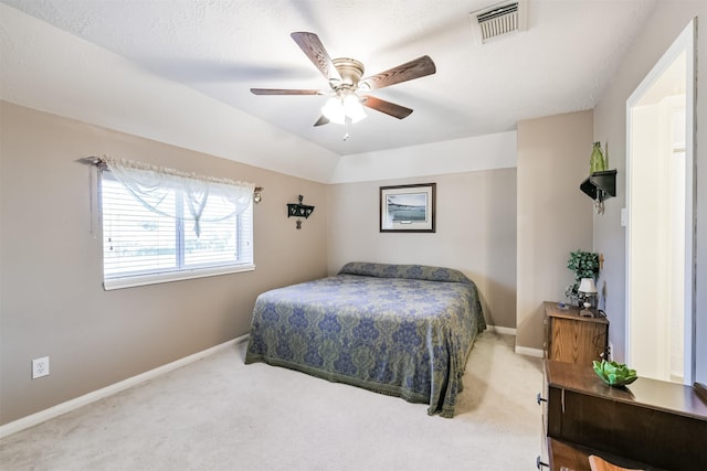 carpeted bedroom featuring visible vents, ceiling fan, baseboards, and lofted ceiling