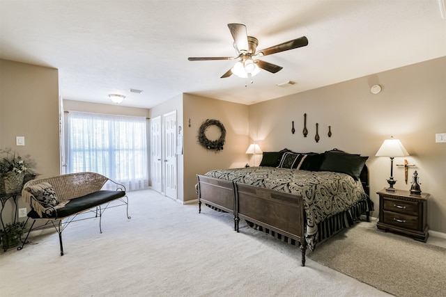 bedroom with visible vents, a ceiling fan, baseboards, and carpet floors