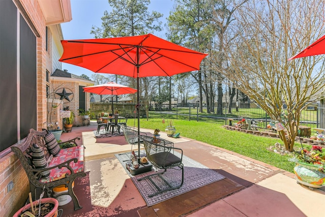 view of patio / terrace featuring outdoor dining space and fence