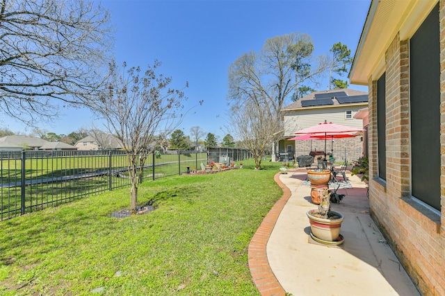 view of yard with a patio area and a fenced backyard