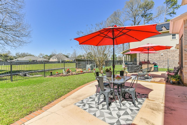 view of patio featuring outdoor dining space, a grill, and a fenced backyard