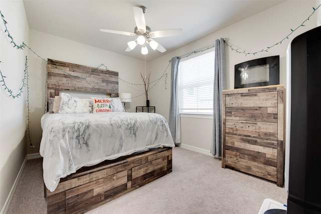 bedroom with baseboards, carpet floors, and ceiling fan