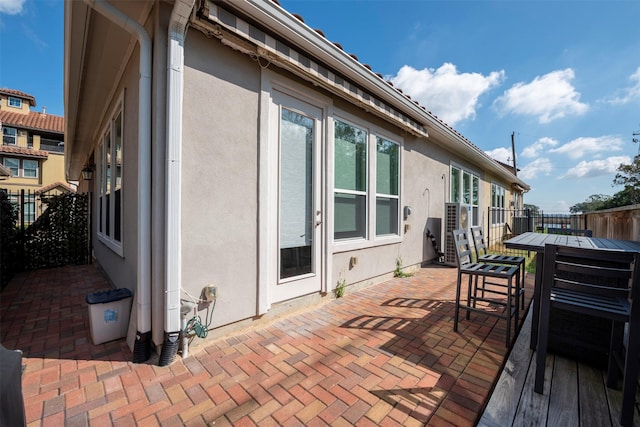 exterior space featuring a patio area and fence