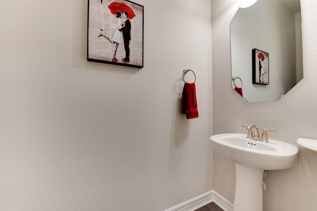 bathroom featuring baseboards