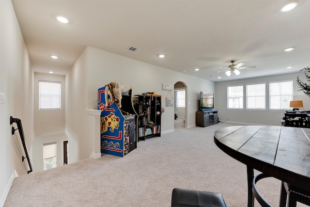 interior space featuring visible vents, recessed lighting, arched walkways, carpet flooring, and baseboards