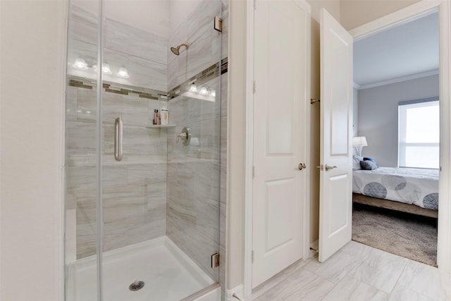 full bath with ensuite bath, a stall shower, and ornamental molding