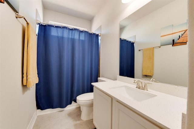 bathroom with tile patterned floors, a shower with shower curtain, toilet, and vanity