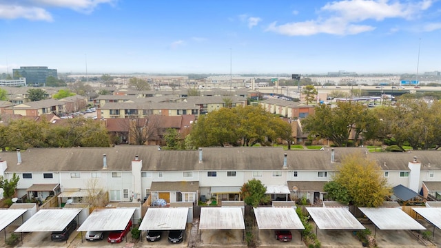 birds eye view of property with a residential view