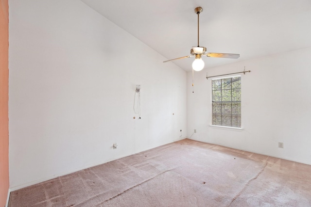 unfurnished room featuring ceiling fan, carpet, and vaulted ceiling