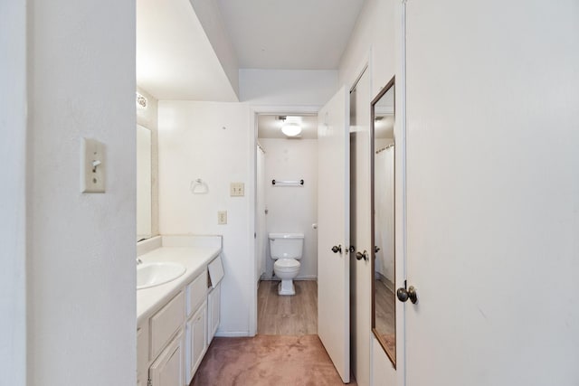 full bathroom with vanity and toilet