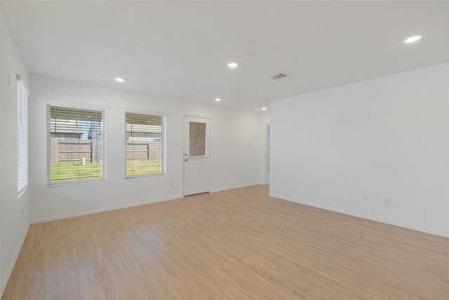 spare room featuring recessed lighting, visible vents, and light wood finished floors