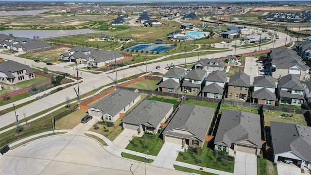 birds eye view of property featuring a residential view and a water view