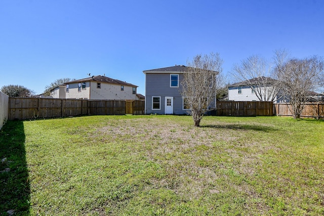 view of yard with a fenced backyard