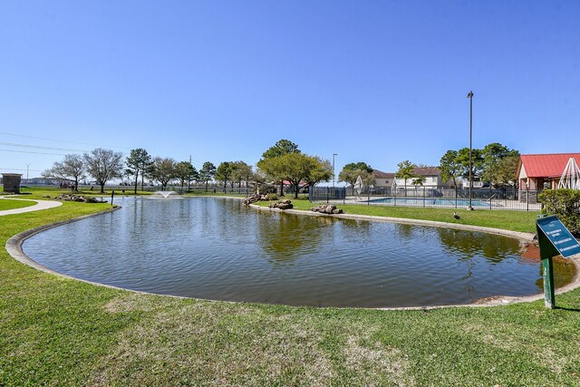 water view featuring fence