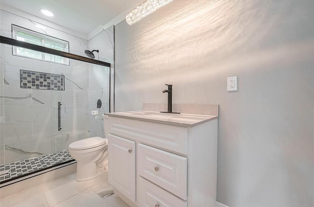 full bath with vanity, a shower stall, and toilet