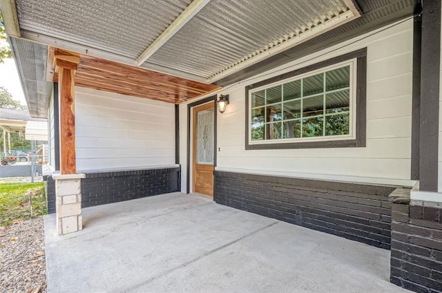 view of patio featuring a porch