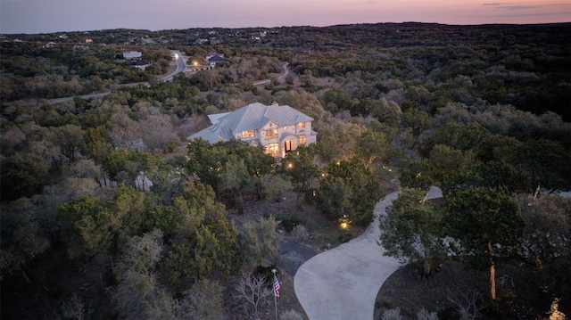 aerial view featuring a view of trees