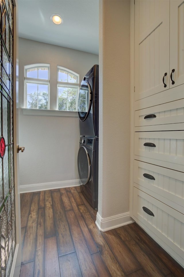 359 Cambridge Dr, New Braunfels, TX 78132 - laundry room with stacked washer and clothes dryer, baseboards, dark wood-style flooring, and recessed lighting