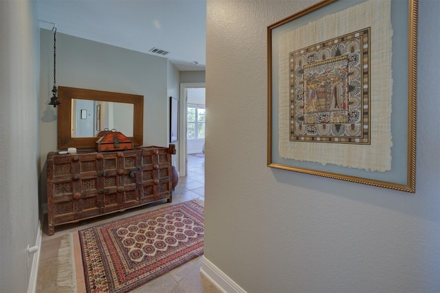 359 Cambridge Dr, New Braunfels, TX 78132 - hallway featuring visible vents, tile patterned floors, and baseboards